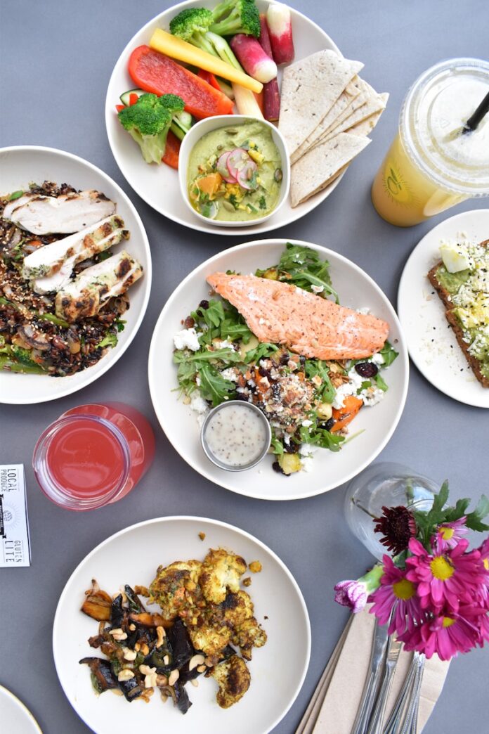 Photo by Shayda Torabi flat-lay photography of assorted-variety of stir fried and vegetable foods
